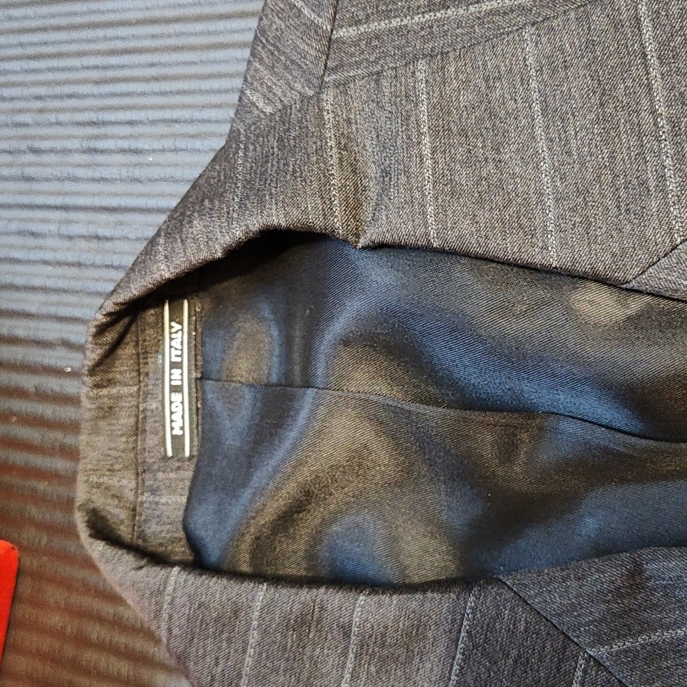 Gray with light white pinstripes suit.